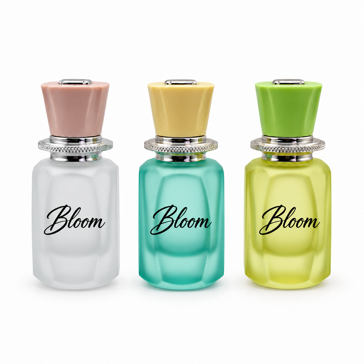 White, turquoise and yellow-green 50ml faceted glass perfume bottles with pink, yellow and green caps respectively, and patterned silver collars.