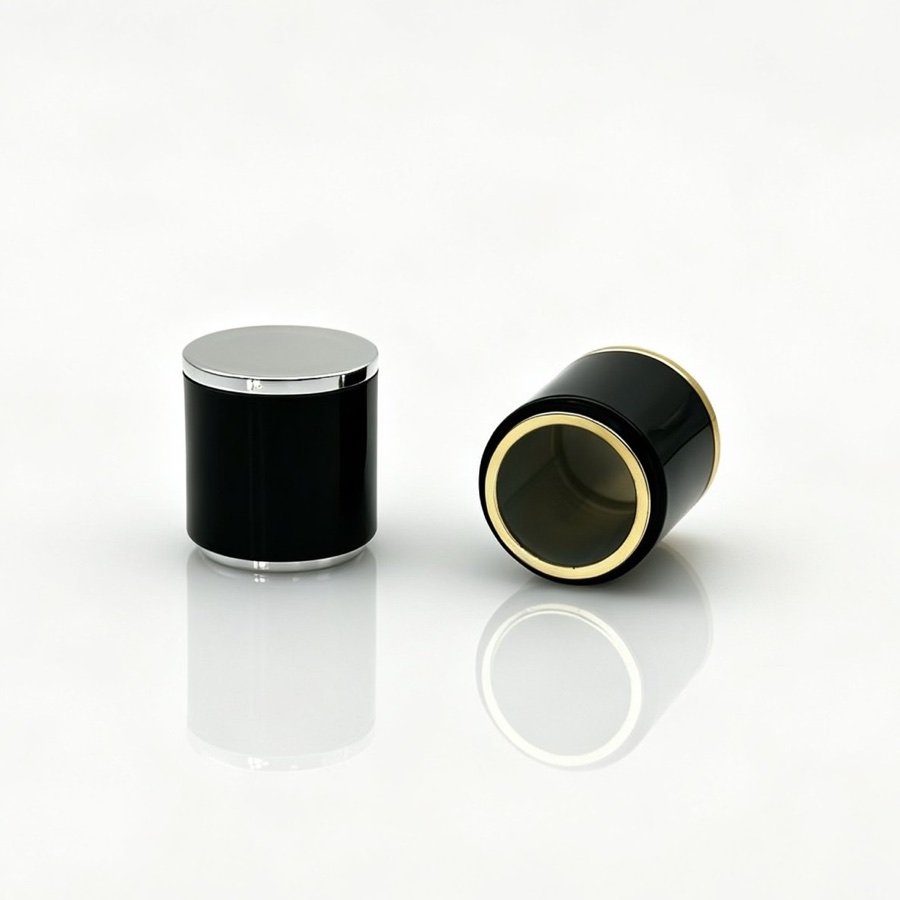 Black cylindrical perfume caps with gold coloured collars